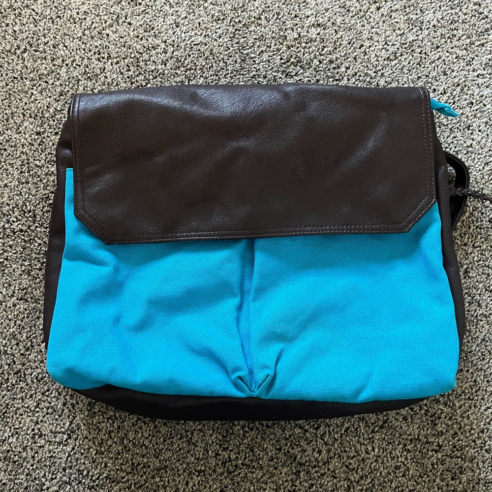 Cooperative canvas and leather backpack